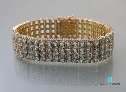 null Ribbon bracelet in vermeil decorated with four lines of blue topazes of round...