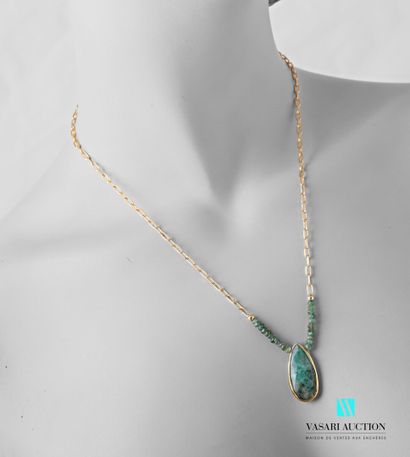 null Necklace adorned with a gold-plated chain finished with faceted emeralds supporting...