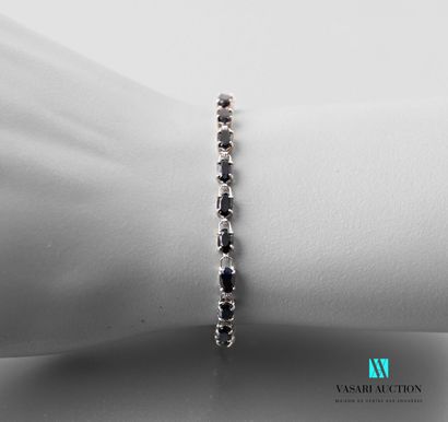 null Bracelet river in white gold 750 thousandths decorated with twenty four sapphires...