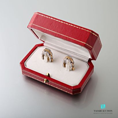 null Cartier, pair of cufflinks in yellow gold 750 thousandths and steel in the form...