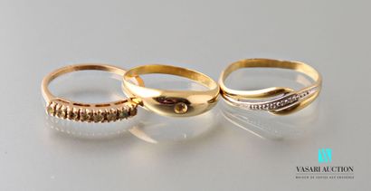 null Three rings in yellow gold 750 thousandth set with stones: a half wedding ring,...