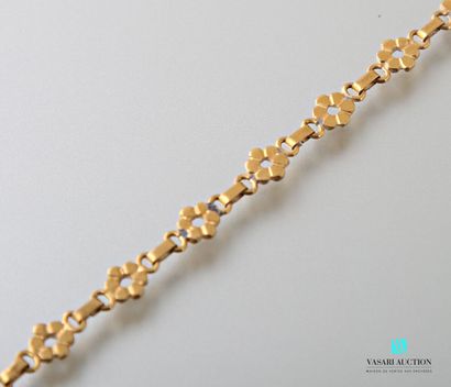 null Bracelet souple en or jaune 750 millièmes à motifs de fleurs et de barrettes...