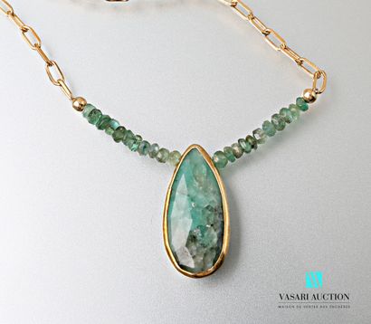 null Necklace adorned with a gold-plated chain finished with faceted emeralds supporting...