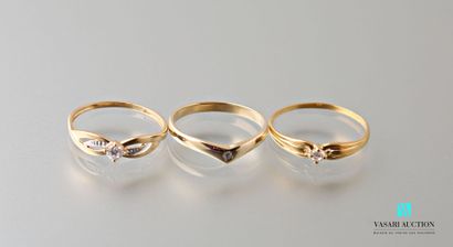 null Three rings in yellow gold 750 thousandth and white stones 
Weight : 3,4 g -...