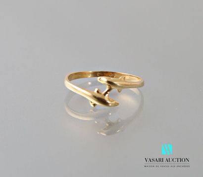 null Yellow gold ring 585 thousandths crossed motives of two dolphins 
Weight : 1,3...