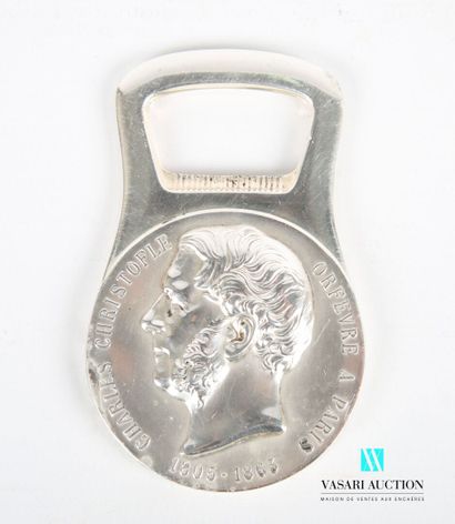 null Silver plated metal bottle opener, the medal-shaped handle presents on the obverse...