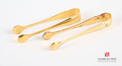 null Pair of gilded metal sugar tongs decorated with baguettes arranged in tiers.
Goldsmith...