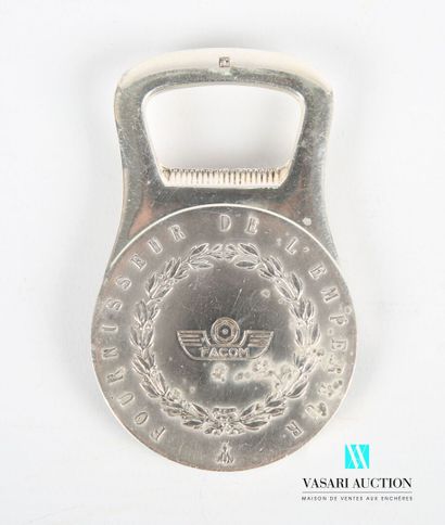 null Silver plated metal bottle opener, the medal-shaped handle presents on the obverse...