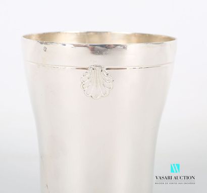 null Silver tumbler of slightly moved form, posing on a flat bottom, the edge underlined...