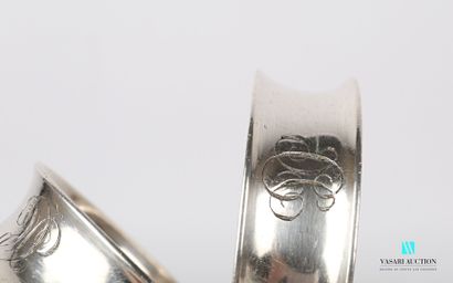 null Pair of napkin rings in silver plated metal, the concave body engraved with...
