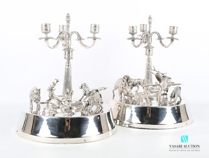 null Pair of silver plated bronze table ends standing on a plain round base surmounted...