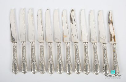 null Twelve dessert knives in silver plated metal, the handle decorated with nets,...