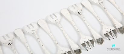 null Suite of twelve silver oyster forks, the handle hemmed with nets and crossed...