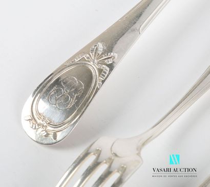 null Part of a silver-plated household set, the handle decorated with a medallion...