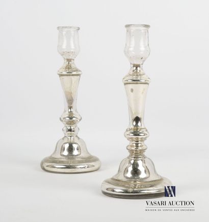 null Pair of glass candlesticks, the interior enhanced with silver leaf, the ringed...