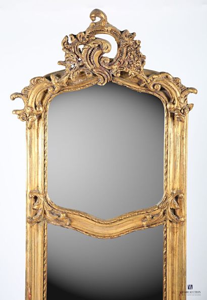 null Wooden mirror and stucco molded carved and painted gilded with stylized foliage...