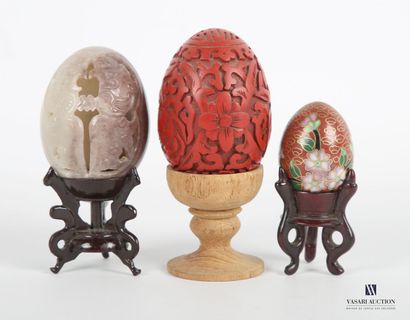 null Lot including three eggs, one in hard stone with openwork birds, the other in...