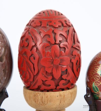 null Lot including three eggs, one in hard stone with openwork birds, the other in...