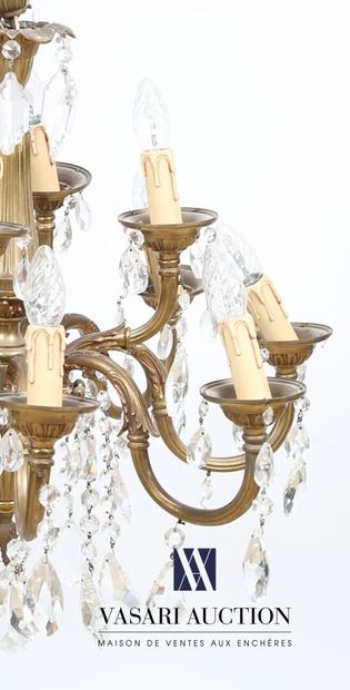 null Bronze chandelier with twelve lights on two levels, the baluster shaft decorated...