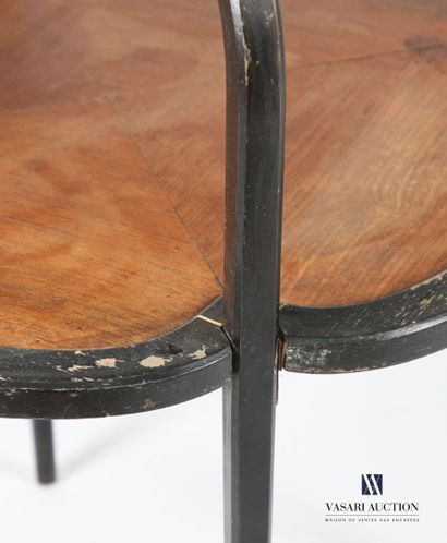 null Tea table in blackened wood and veneer, the upper tray of square shape rests...