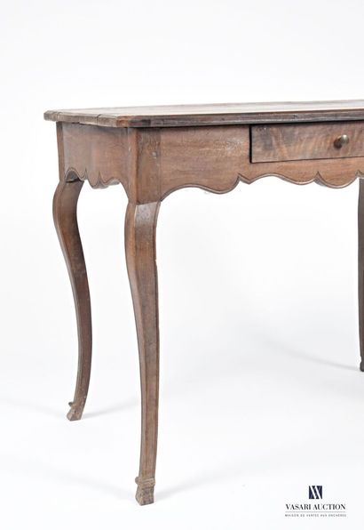 null Writing table in molded natural wood, the rectangular top has cut angles, the...