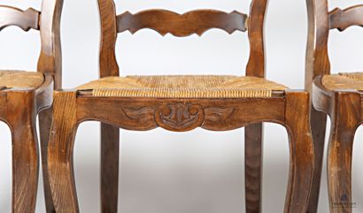 null Suite of three chairs in natural wood molded and carved with flowers and foliage,...