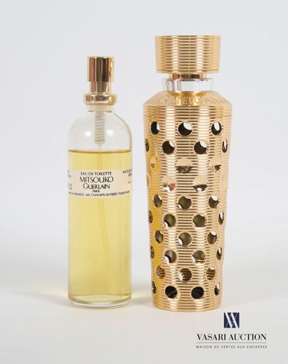 null GUERLAIN 
A refillable openwork spray containing a "Mitsouko" eau de toilette...