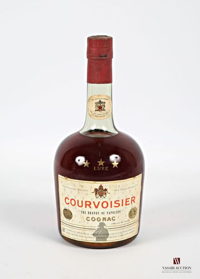 null 1 bouteille	Cognac *** Luxe COURVOISIER		
	70 cl - 40°. Et. un peu tachée. N...