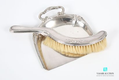 null White metal crumb catcher decorated with nets, ribbons and leafy clasps including...