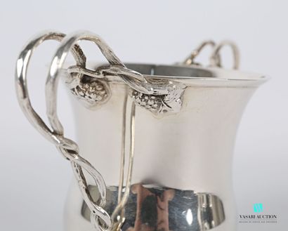 null Silver bowl on a flat bottom, the flared body has two handles simulating intertwined...