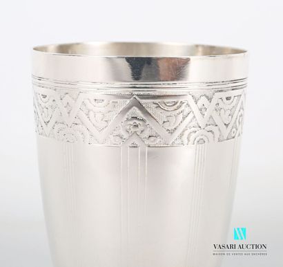 null Silver tumbler with a slightly flared body on a flat base, the body decorated...