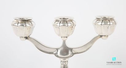 null Pair of hammered silver candlesticks 830 thousandths posing on a round base...