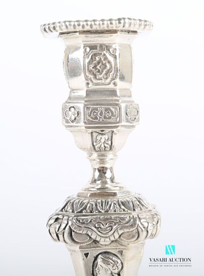 null Suite of four silver torches standing on an octagonal base hemmed with foliage...