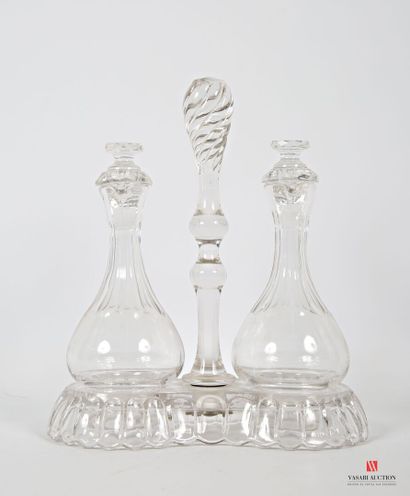 null A crystal lot including an oil and vinegar cruet on a hemmed base, it supports...