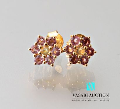 null Pair of earrings in vermeil, the petals set with pink toumalines surrounding...