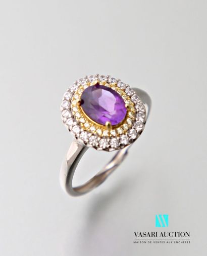 null Silver ring 925 thousandths set with an oval amethyst hemmed with white and...