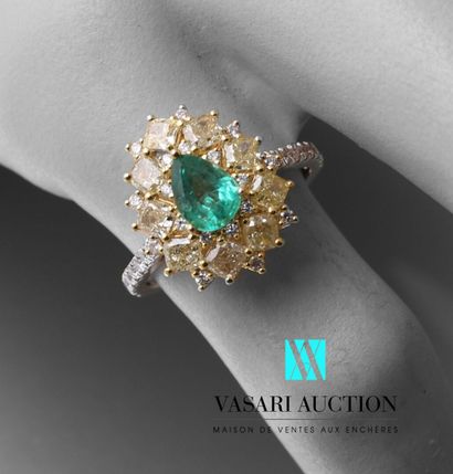 null Yellow and white gold ring set with a pear-cut emerald of 0.55 carat in a setting...