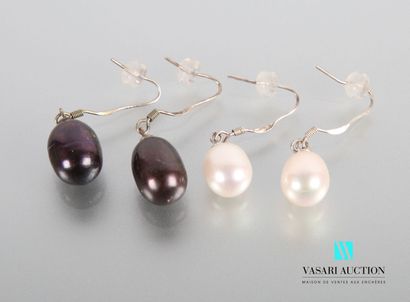 null Two pairs of silver earrings adorned with white and black tinted freshwater...