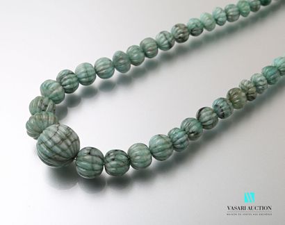 null Ethnic style necklace adorned with emerald root beads on a sliding cord.
