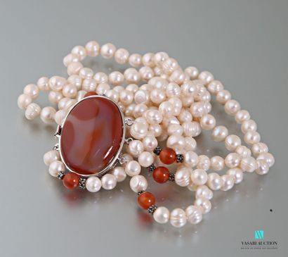 null Necklace with three rows of freshwater pearls, the clasp cabochon agate tinted...