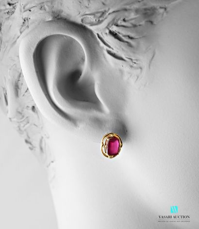 null Pair of gilt silver earrings set with oval cut treated rubies, the clasps Belgian...