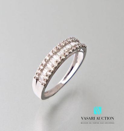 null Half wedding ring in white gold 750 thousandth set with a line of baguette diamonds...