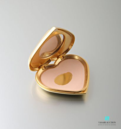 null Yves SAINT LAURENT 
Poudrier en forme de coeur en métal doré orné d'un cabochon...