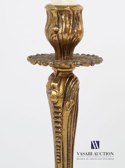 null Pair of ormolu lampstands standing on four slightly twisted legs, the base decorated...