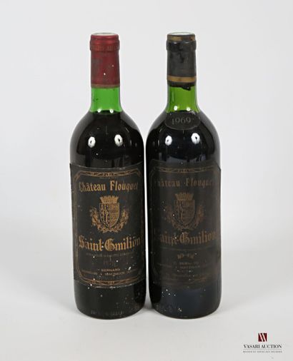 null 2 bouteilles	Château FLOUQUET	St Emilion	
	1 blle de 1979, 1 blle de 1969.		
	Et....