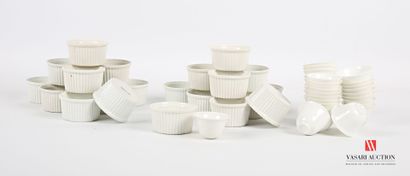 null Lot including a suite of twenty-eight cups or sake glasses in white porcelain...