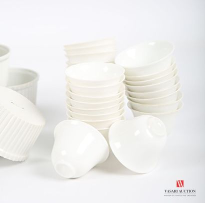 null Lot including a suite of twenty-eight cups or sake glasses in white porcelain...