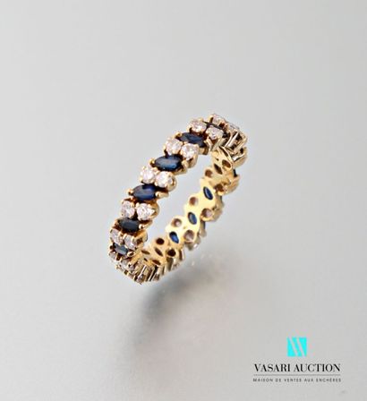 null American wedding band in 750 thousandths yellow gold set with navette sapphires...