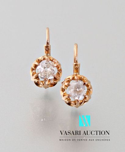 null A pair of 750 thousandths yellow gold dormeuses set with two cushion-cut diamonds...
