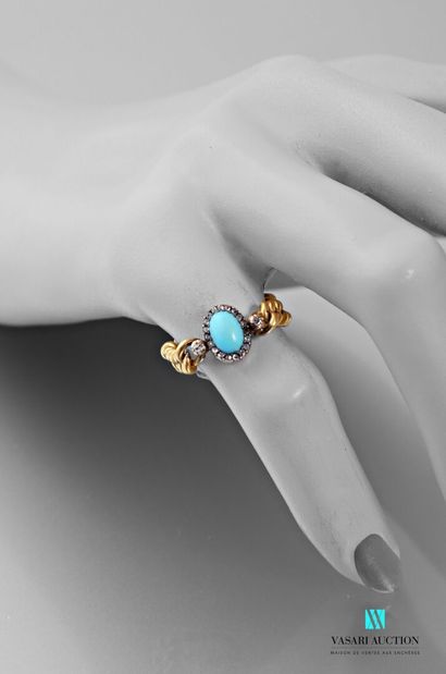 null Flexible ring in 750 thousandths yellow gold set with an oval turquoise surrounded...